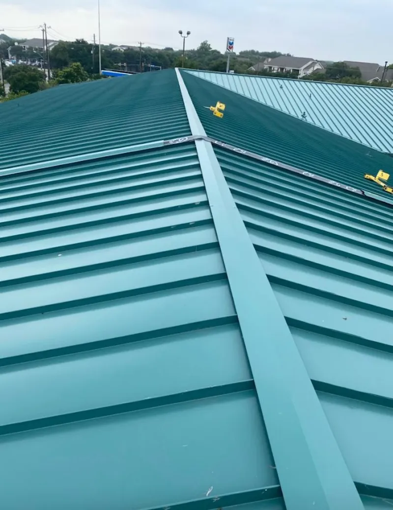 Green commercial metal roof ridge and valley for Metal Roof Repair in Aransas Pass
